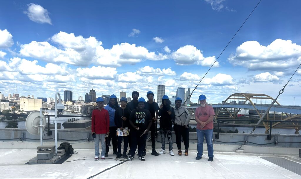 people posing for photo outside