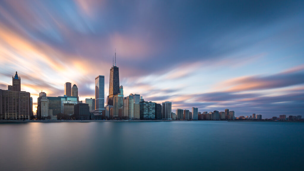 View of Chicago skyline at sunset with Lake Michigan in front